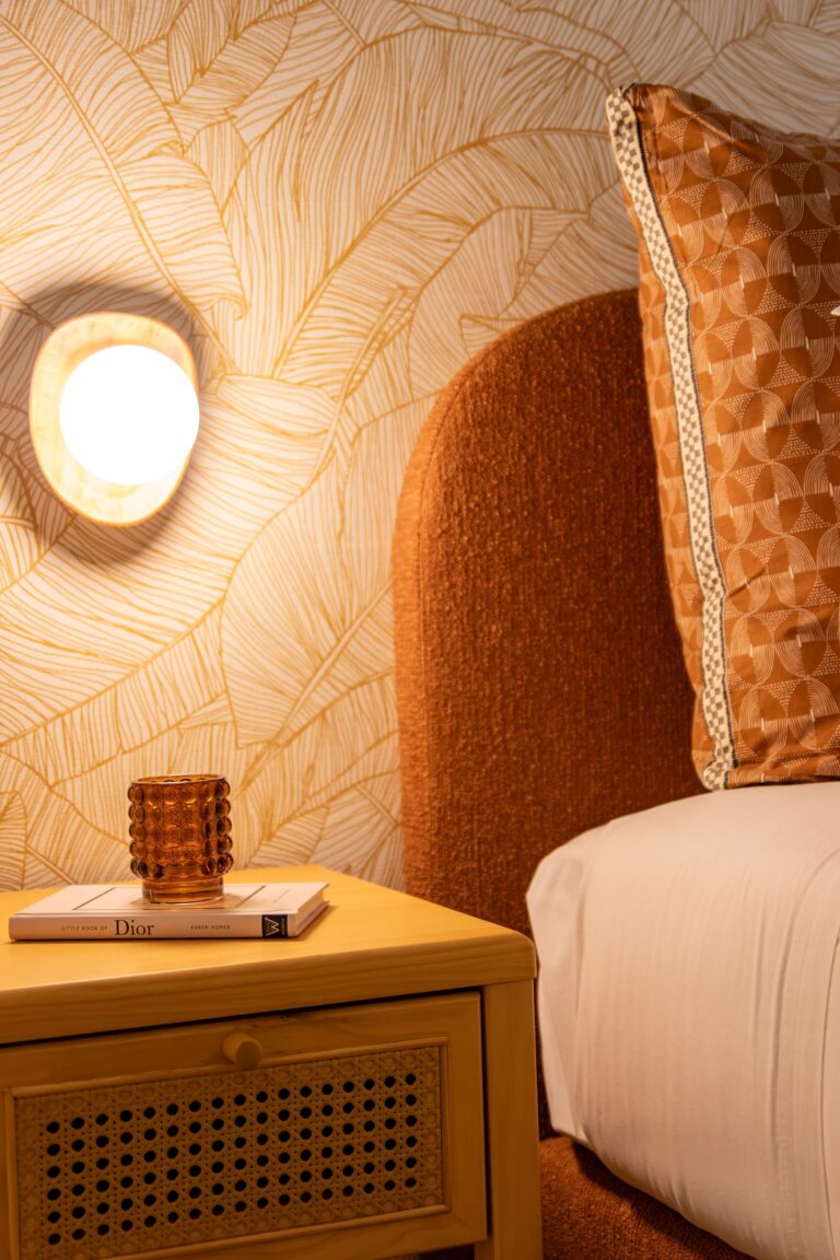 bright orange statement piece light scone wall light