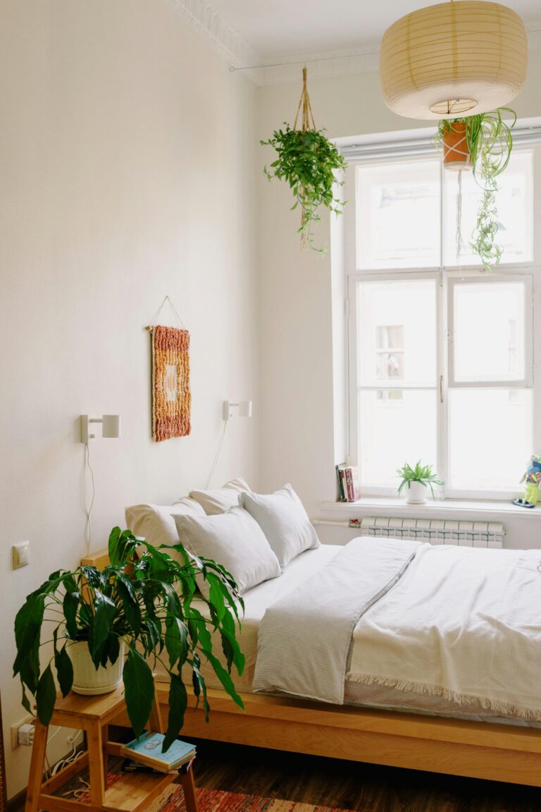 white bedroom with light window and rattan overhead light to transform the mood