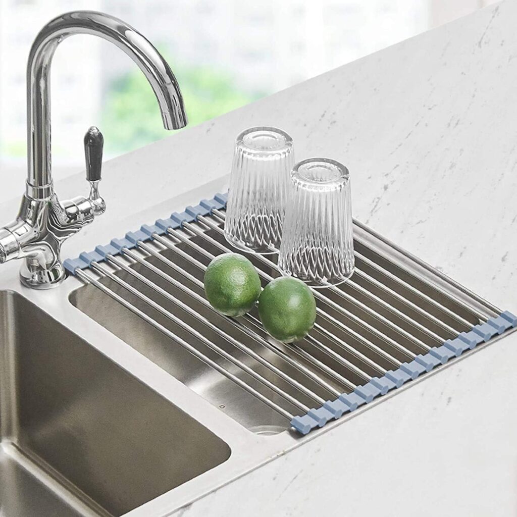 metal roll up dish rack on top of sink