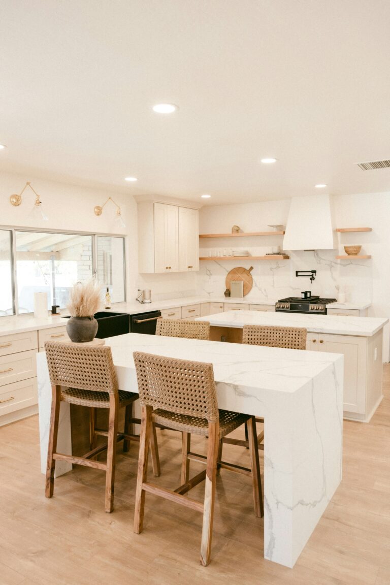 organized kitchen with floating shelves and kitchen table
