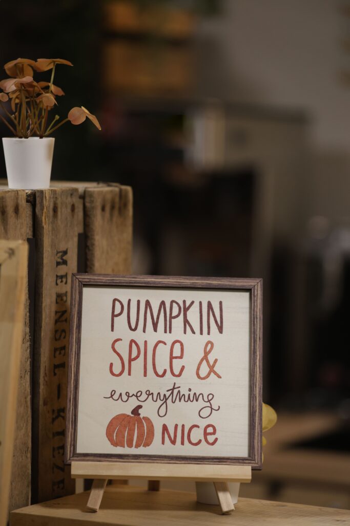 Fall bedroom decor sign next to books