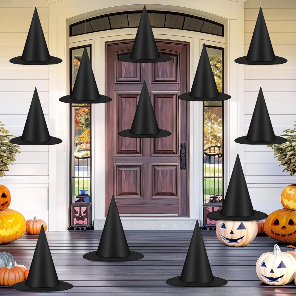 witch hats hanging from ceiling on front porch