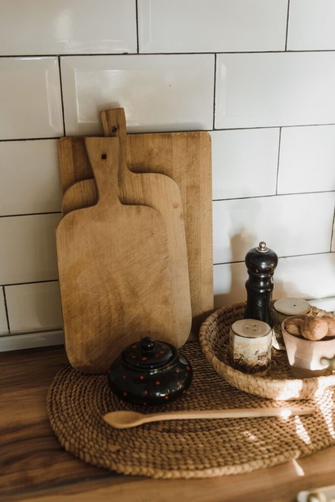 cutting boards leaned up against the backsplash to act as a fall kitchen decor item