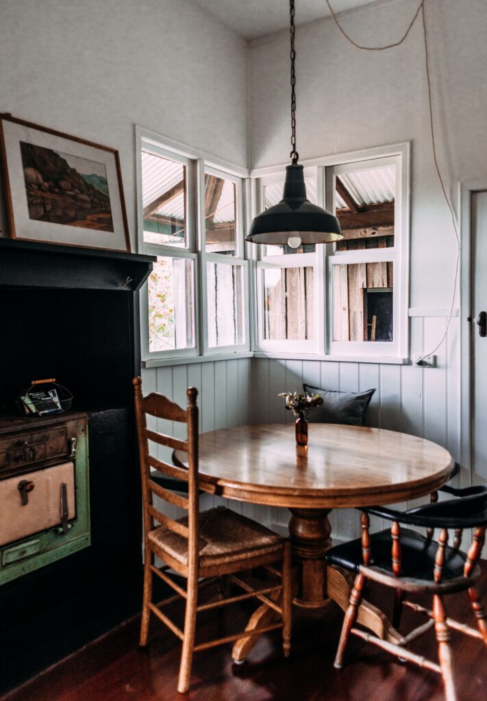 rustic dining room with a pendant light