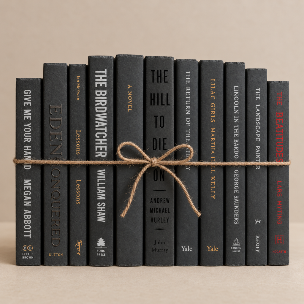 black books with twine wrapped around