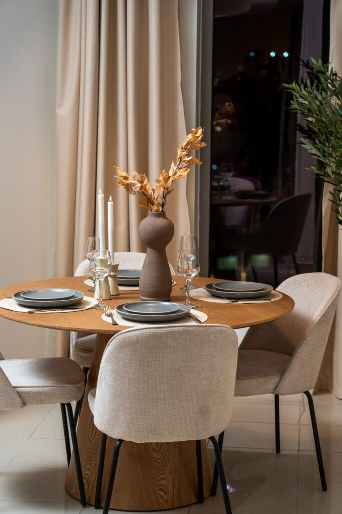 A round modern dining room table with modern chairs